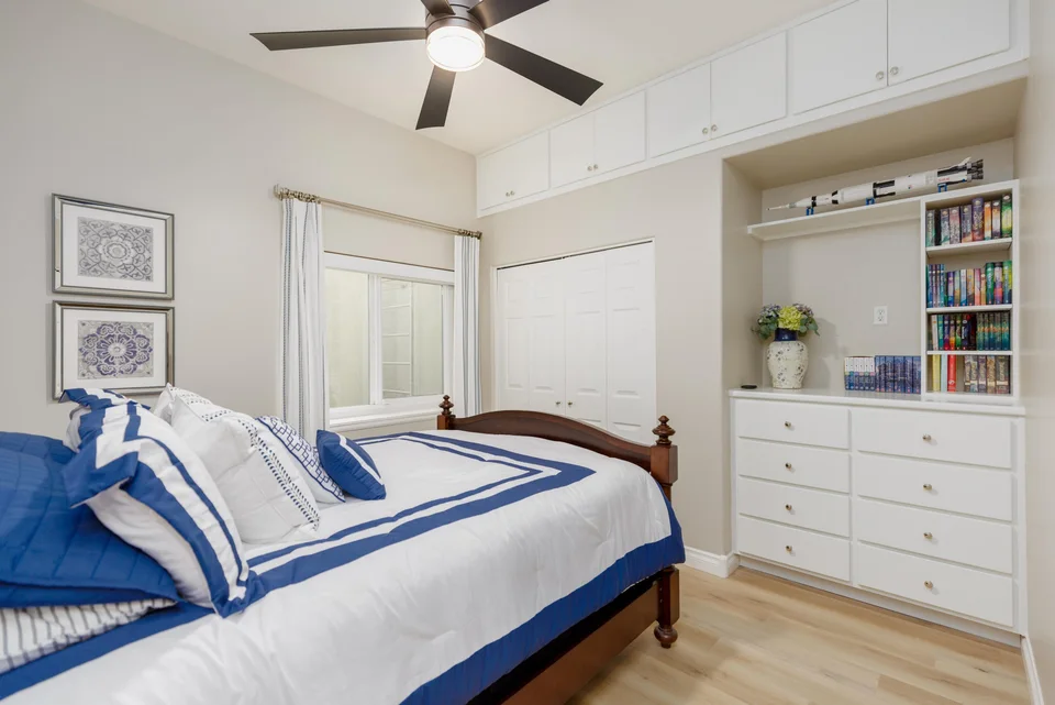Bedroom with white built-in cabinetry